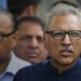Pakistan Tehreek-i-Insaf party candidate Arif Alvi (C) walks back with party leaders after submitting papers for the presidential election outside the high court building in Islamabad on August 27, 2018. Pakistan will hold presidential elections on September 4. / AFP / FAROOQ NAEEM